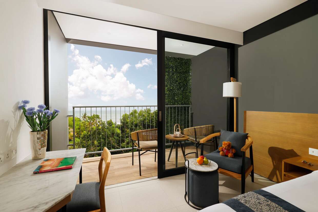 View from custom bedroom toward balcony at Citadines Berawa Beach hotel in Bali