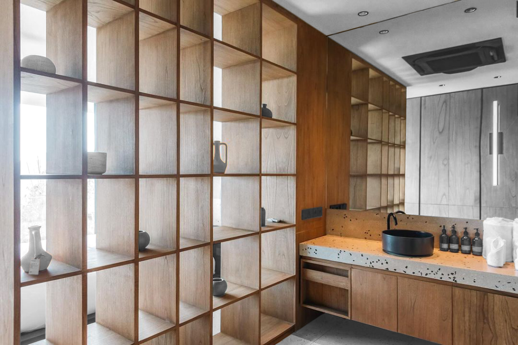 Bespoke bathroom vanity with integrated tall shelving unit at Villa Layang